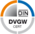 Ein rundes Logo besteht aus vier farbigen Segmenten (orange, blau, grau, schwarz) mit dem mittigen Text "DVGW" auf weißem Hintergrund.